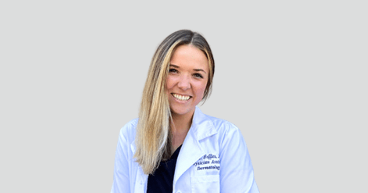 woman smiling in white coat