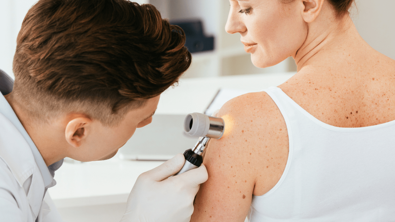 woman getting her skin checked out