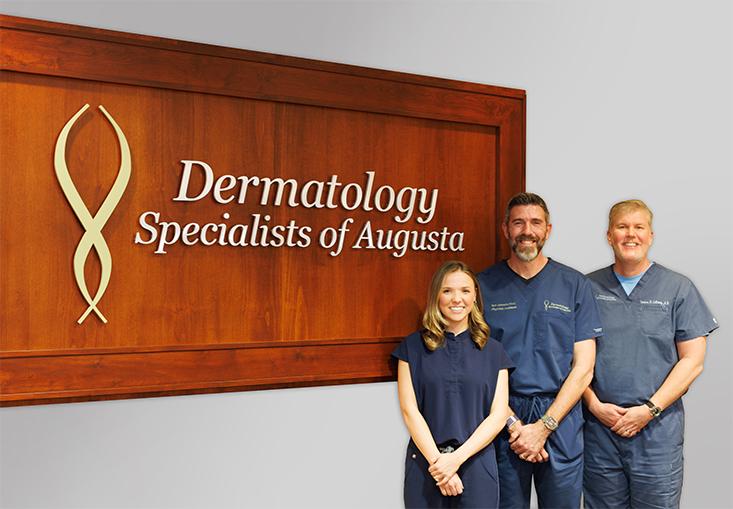 The Dermatology Specialists of Augusta providers standing in front of the DSA sign.