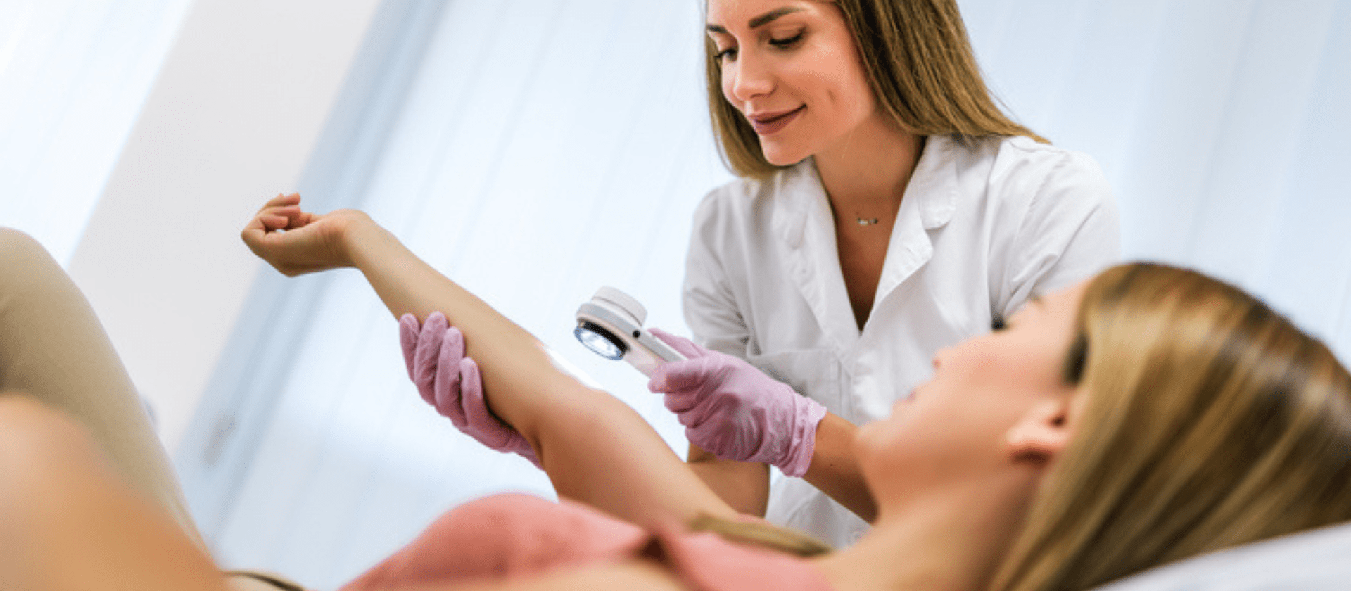 dermatologist looking at a patient's arm